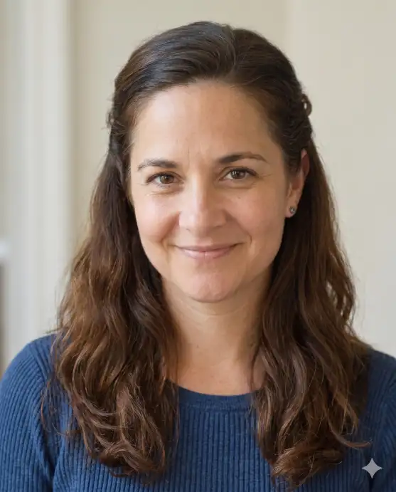 Create a realistic portrait using the uploaded photo, keeping the face and features exactly the same. Change only the hairstyle to a half-up half-down style, with the top section pulled back softly and the rest falling in loose waves around the shoulders. The color is a natural medium brown. The person faces forward with a warm, easy smile. Use eye-level framing with soft natural light and a clean light background. Keep the face identical and the result photorealistic. Use aspect ratio 4:5.