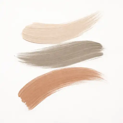 Create an abstract wall art piece featuring three bold, sweeping brushstrokes arranged vertically on a clean white background. The brushstrokes are painted in warm neutral tones: soft beige, warm taupe, and muted clay. Each stroke is thick and textured, showing the natural variation of paint loading on a wide flat brush, with visible bristle marks and edges that taper to thin ends. The strokes are slightly overlapping and arranged with intentional asymmetry. The overall mood is calm, organic, and sophisticated. No text, no additional elements. Use aspect ratio 1:1.