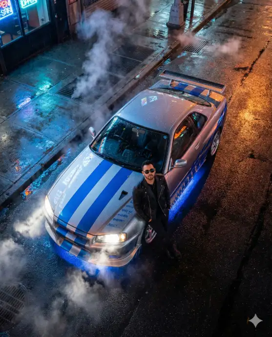Create an ultra-realistic cinematic night scene shot from an extreme top-down bird's-eye view, featuring a modified high-performance sports car parked on a rain-soaked urban street. The car is metallic silver with bold electric-blue racing stripes running down the hood and roof, aggressive hood vents, a large rear spoiler, and glowing LED headlights cutting through the mist. A confident man stands casually beside the front of the car, leaning slightly against the bumper. He wears a black jacket, dark jeans, and black boots, with sleek dark sunglasses despite the night setting. He has short styled hair, a trimmed beard, and a calm, dominant expression, looking upward toward the camera. His posture conveys control, confidence, and modern urban power. The street surface is wet and reflective, mirroring neon signage, headlights, and blue underglow lighting beneath the car. Steam rises from street vents and the asphalt, drifting through the scene and adding depth and atmosphere. Blue accent lighting spills across the ground, contrasting with warm orange reflections from nearby storefront lights. Lighting is cinematic and high-contrast: cool blue neon highlights, warm urban reflections, sharp headlight beams, and soft volumetric steam. Raindrops bead across the car's surface, emphasizing texture and realism. Use aspect ratio 4:5.
