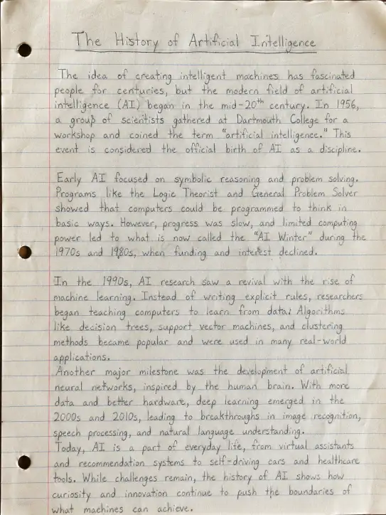 Create a realistic top-down photo of a handwritten school assignment on slightly aged off-white lined notebook paper with faint blue horizontal lines and a red margin line on the left, titled "The History of Artificial Intelligence" written in pencil at the top, followed by multiple short paragraphs in natural pencil handwriting discussing early AI development, key milestones like machine learning and neural networks, and modern advancements, with subtle wrinkles, light smudges, and soft natural lighting for a classroom desk feel, aspect ratio 3:4.