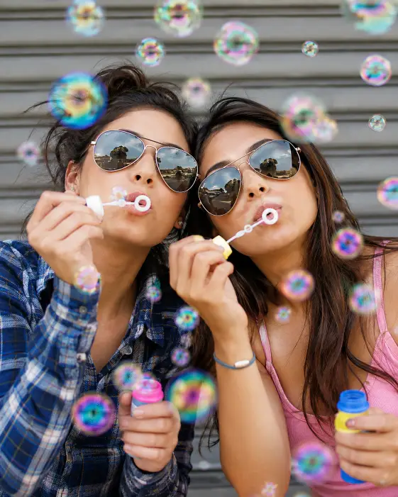 Blowing Bubbles in Matching Sunglasses