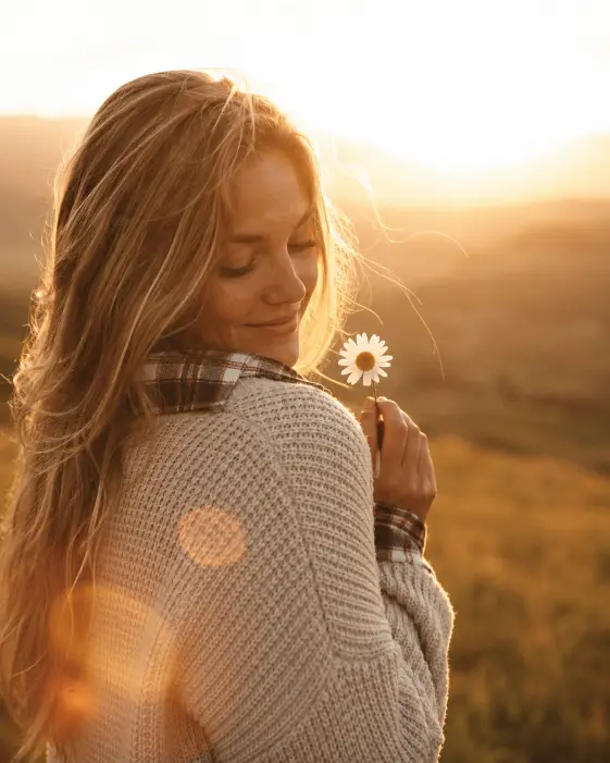 7. Holding a Daisy in the Last Light
