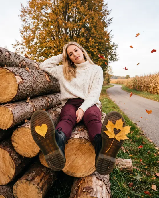 Sitting on a Log Pile With Heart Leaves